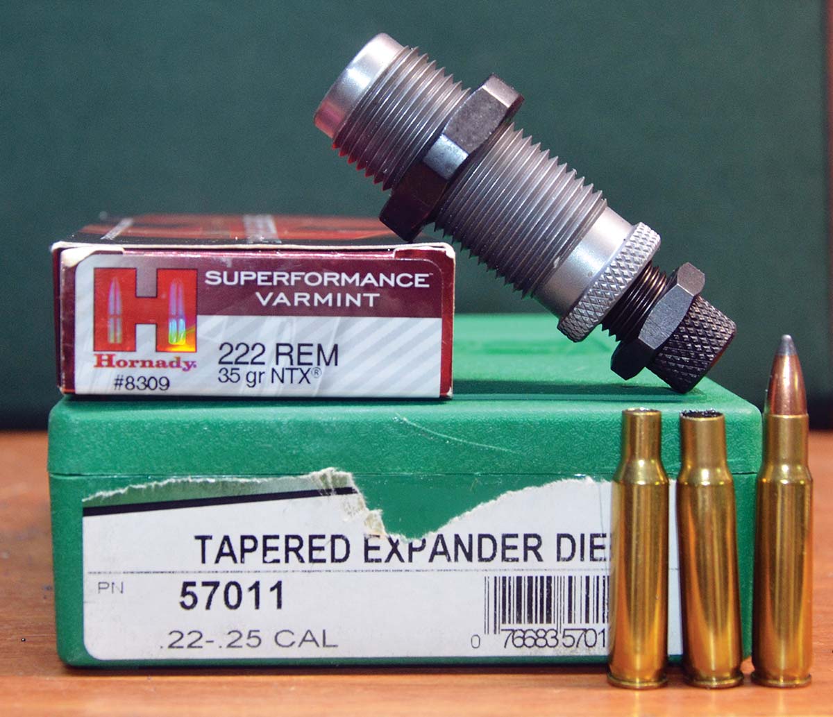 As John Wootters did in the past, the first step toward the 25-222 Copperhead today is to use an expander die to open up the 222 Remington case for .257-inch bullets: (1) 222 Remington case, (2) same case necked up to 25 caliber and (3) a loaded 25-222 Copperhead round.